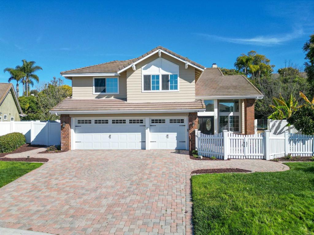 354 Lustrosos Street Oceanside, CA 92057 - Photo 1 of 75 a front view of a house with a yard