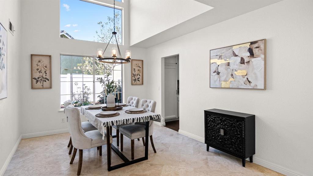 354 Lustrosos Street Oceanside, CA 92057 - Photo 12 of 75 a dining room with furniture a chandelier and window