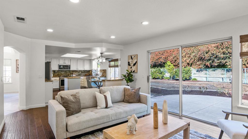 354 Lustrosos Street Oceanside, CA 92057 - Photo 19 of 75 a living room with furniture and a large window