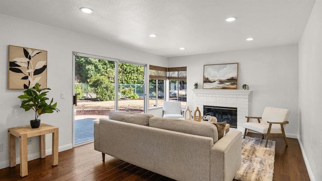 354 Lustrosos Street Oceanside, CA 92057 - Photo 20 of 75 a living room with furniture and a fireplace