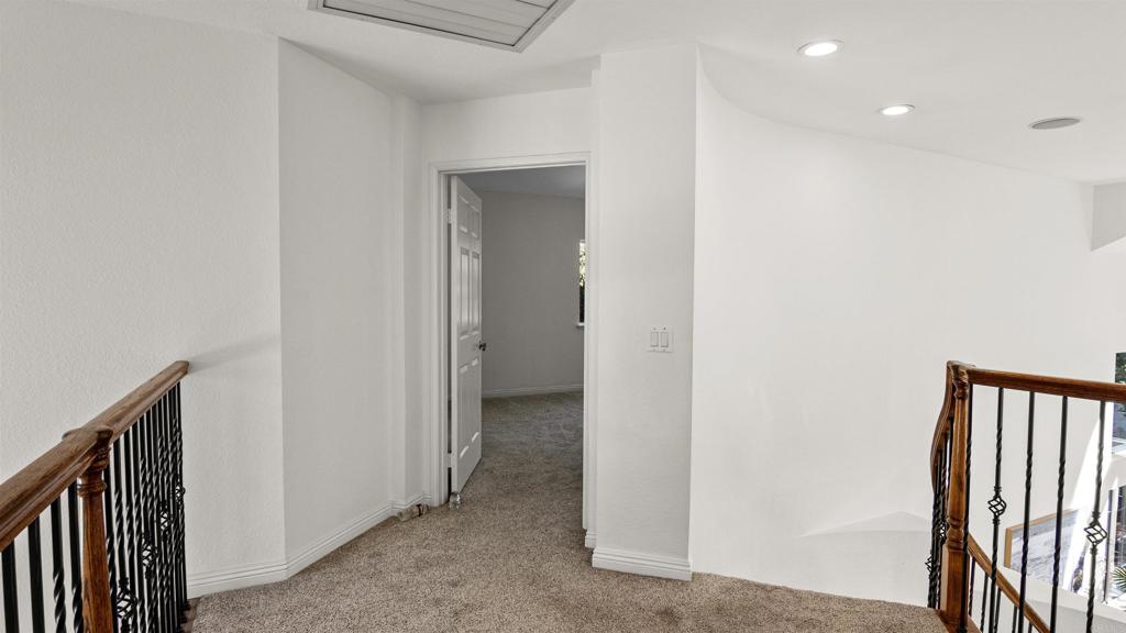 354 Lustrosos Street Oceanside, CA 92057 - Photo 32 of 75 a view of a hallway with a hallway