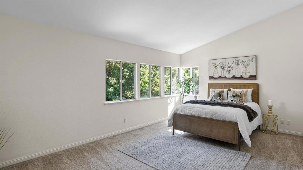 354 Lustrosos Street Oceanside, CA 92057 - Photo 33 of 75 a bed sitting in a bedroom next to a window