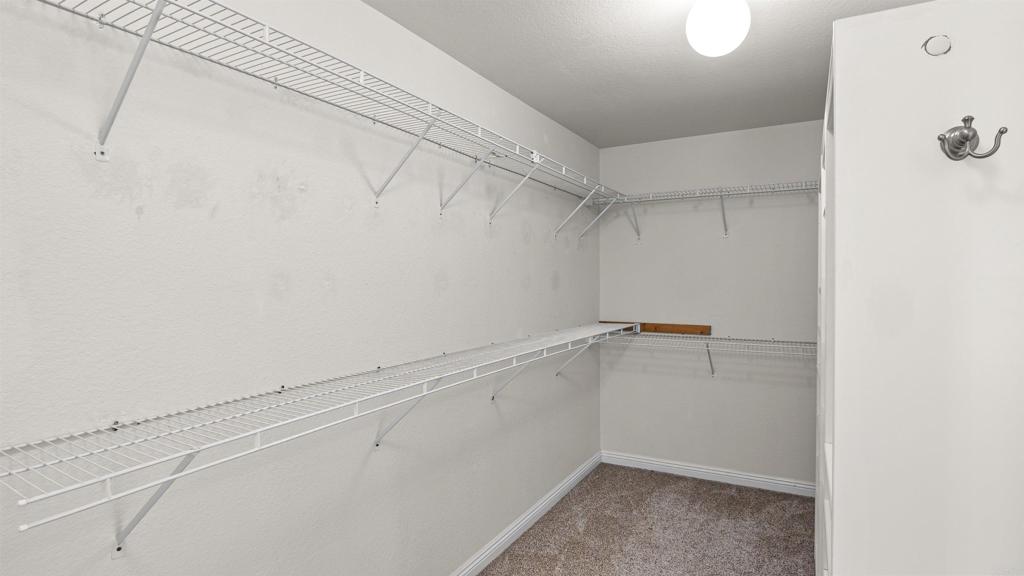 354 Lustrosos Street Oceanside, CA 92057 - Photo 38 of 75 a view of a room with racks on the wall