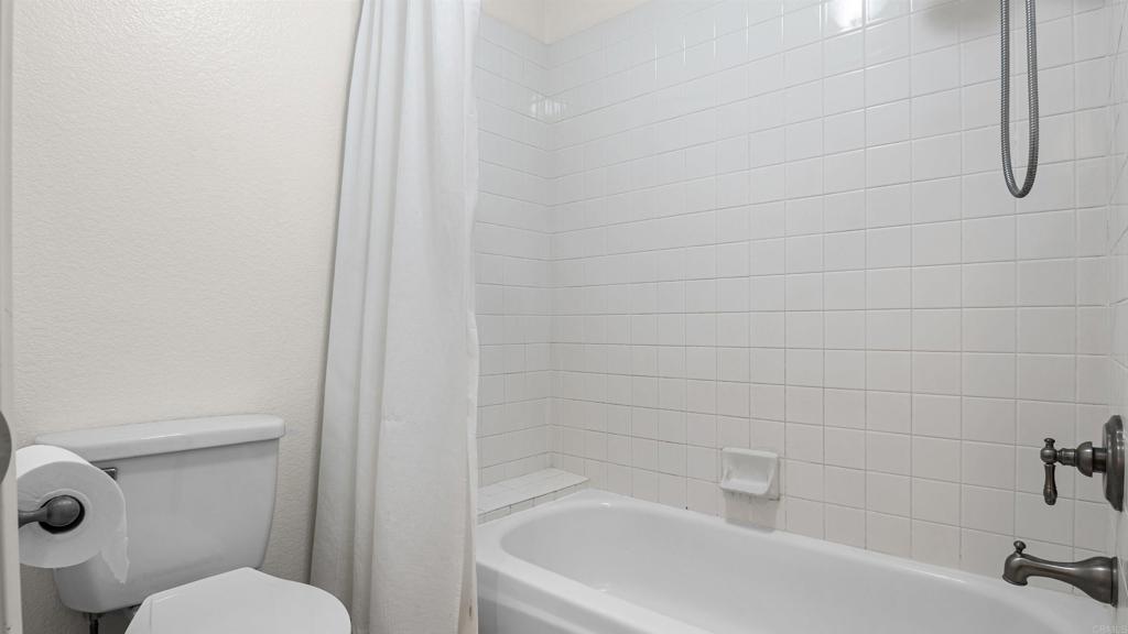 354 Lustrosos Street Oceanside, CA 92057 - Photo 41 of 75 a white bath tub sitting next to a white toilet