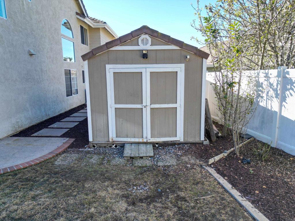 354 Lustrosos Street Oceanside, CA 92057 - Photo 46 of 75 a front view of a house with a yard
