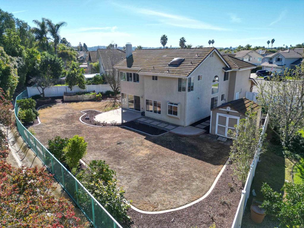 354 Lustrosos Street Oceanside, CA 92057 - Photo 49 of 75 a view of a house with a backyard porch and sitting area