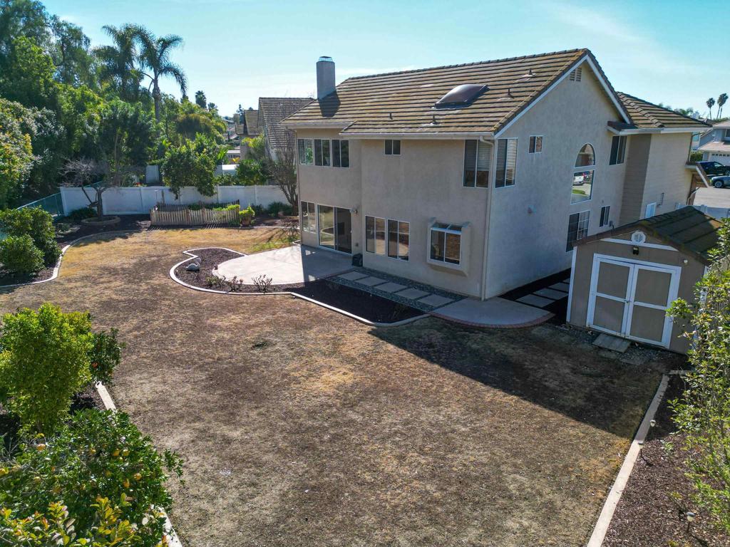 354 Lustrosos Street Oceanside, CA 92057 - Photo 55 of 75 a view of a house with backyard and trees