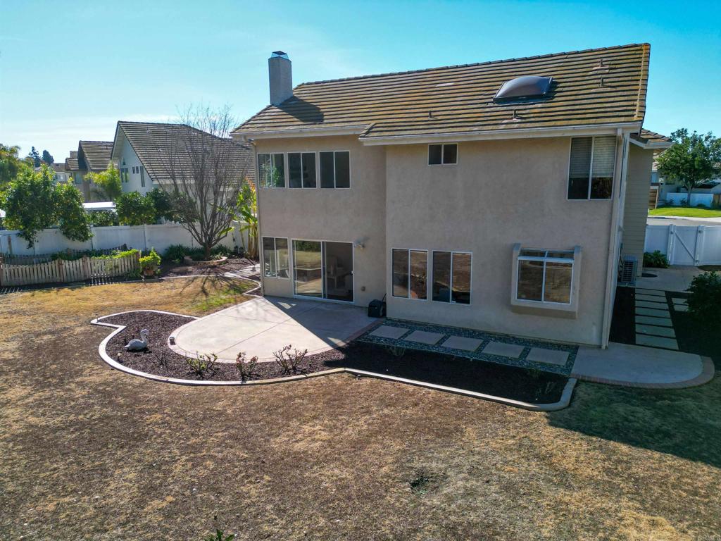 354 Lustrosos Street Oceanside, CA 92057 - Photo 57 of 75 a front view of a house with a yard