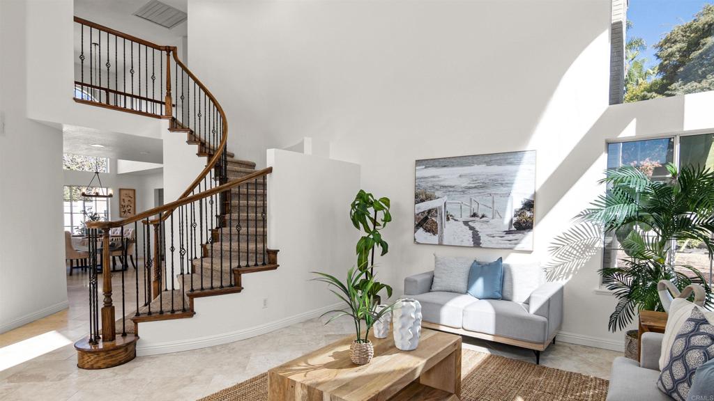 354 Lustrosos Street Oceanside, CA 92057 - Photo 7 of 75 a living room with furniture and a potted plant