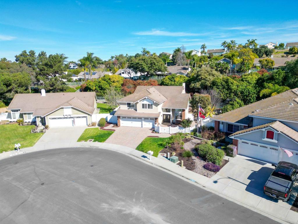 354 Lustrosos Street Oceanside, CA 92057 - Photo 71 of 75 an aerial view of a house with a yard and garden