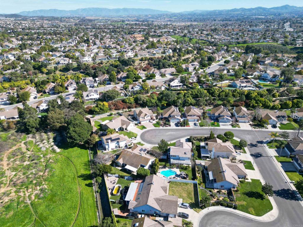 354 Lustrosos Street Oceanside, CA 92057 - Photo 73 of 75 an aerial view of a houses with a lake view