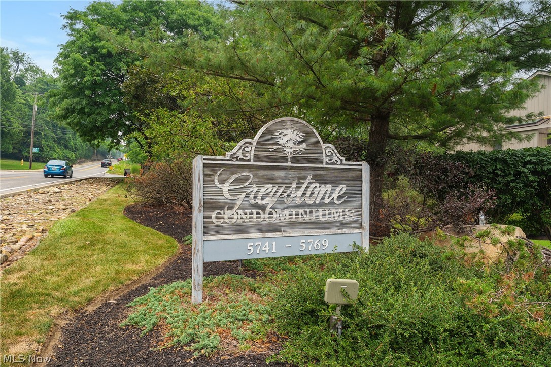 5741 Som Center Road, Unit 1 Solon, OH 44139 - Photo 46 of 50 Greystone Condominiums entry sign featuring a carved wood-look finish