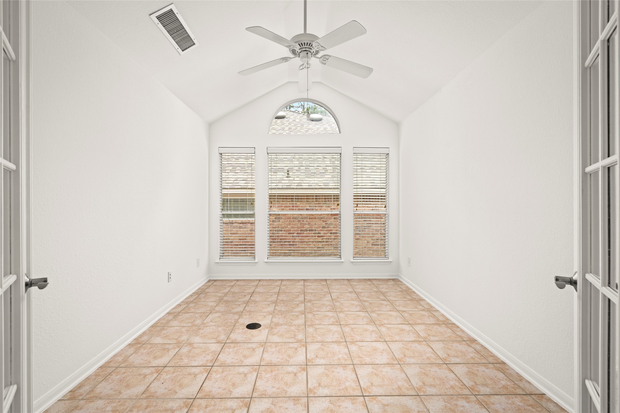 142 South Veranda Ridge Drive Spring, TX 77382 - Photo 13 of 31 The spacious Flex Room with French doors, vaulted ceilings, and a wall of windows creating a light and airy feel.