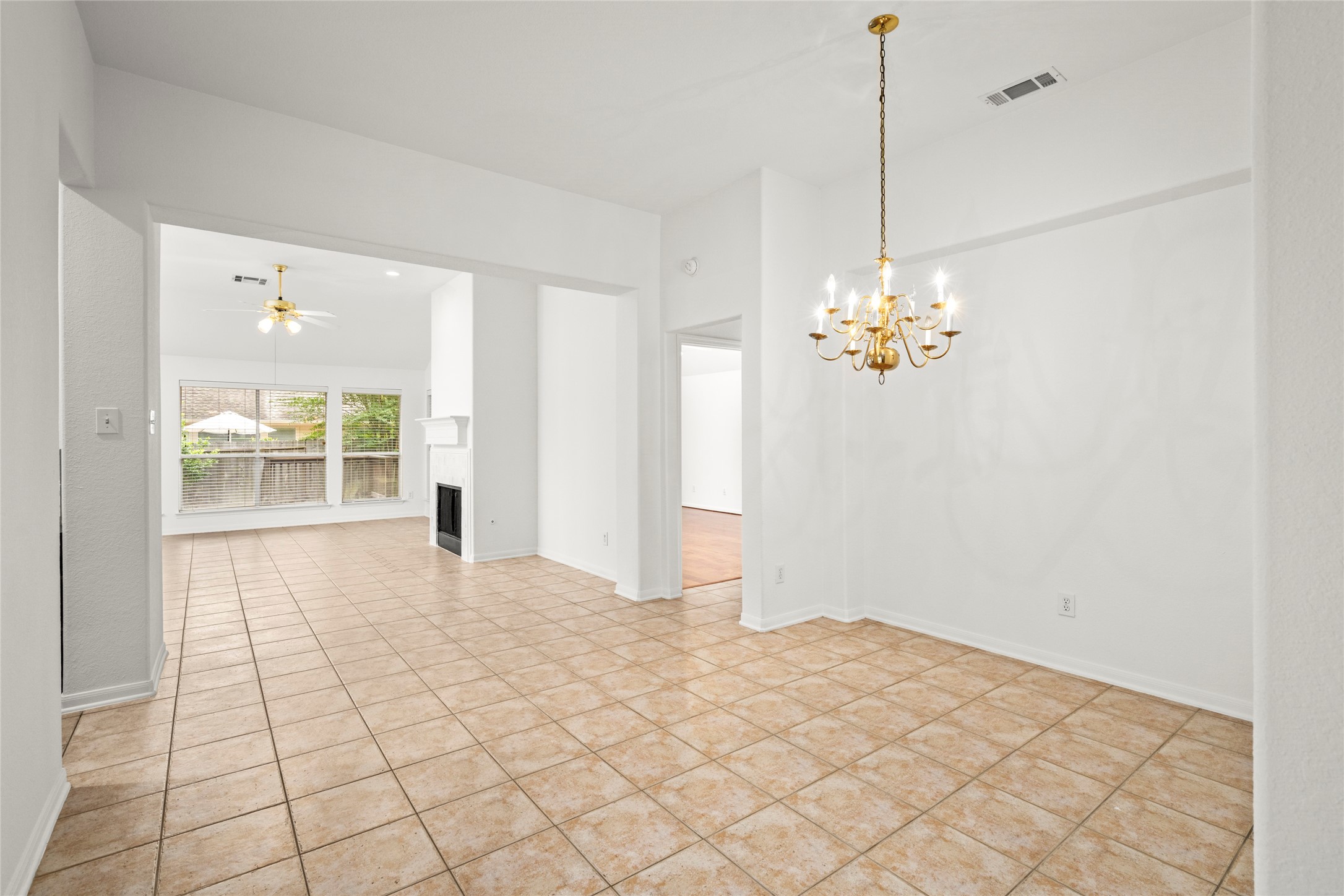 142 South Veranda Ridge Drive Spring, TX 77382 - Photo 6 of 31 An alternate view of the Formal Dining Room, showcasing the easy access to the Living Room and offering an open layout ideal for gatherings and entertaining.