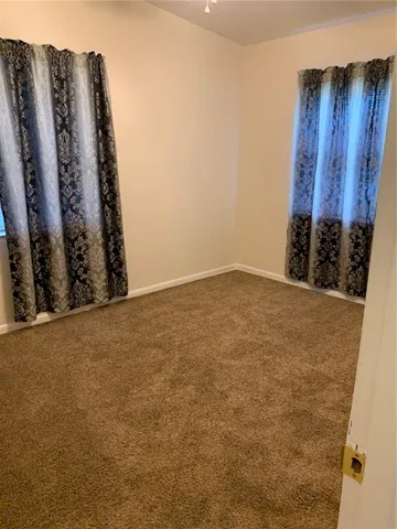 a view of a room with window and an outdoor view