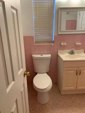 a kitchen with a sink cabinets and a window