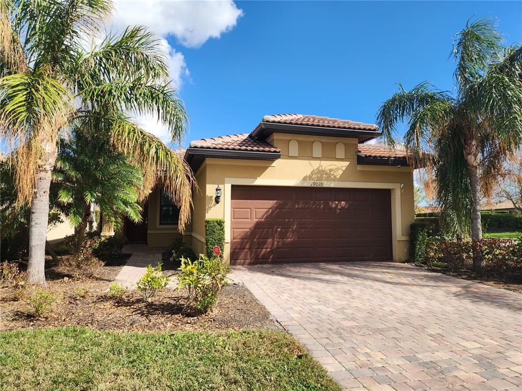 19010 Mangieri Street Venice, FL 34293 - Photo 1 of 1 a front view of a house with a yard
