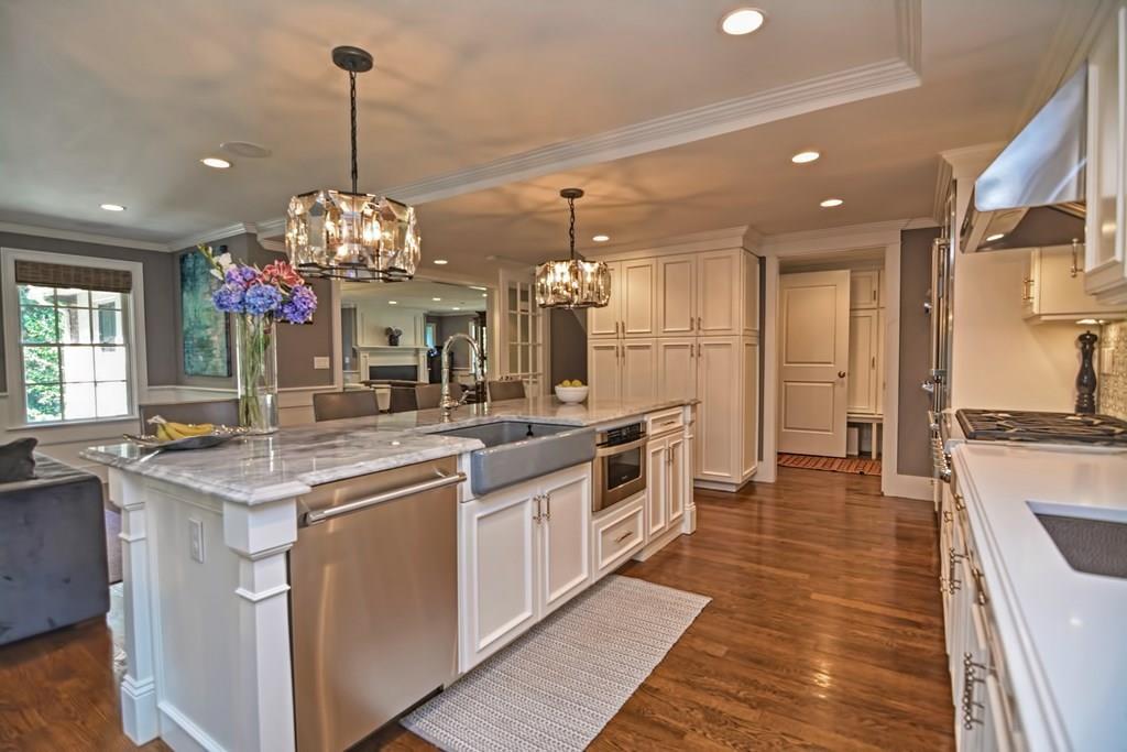 70 Arnold Road Newton, MA 02459 - Photo 3 of 39 a kitchen with stainless steel appliances granite countertop a sink and cabinets