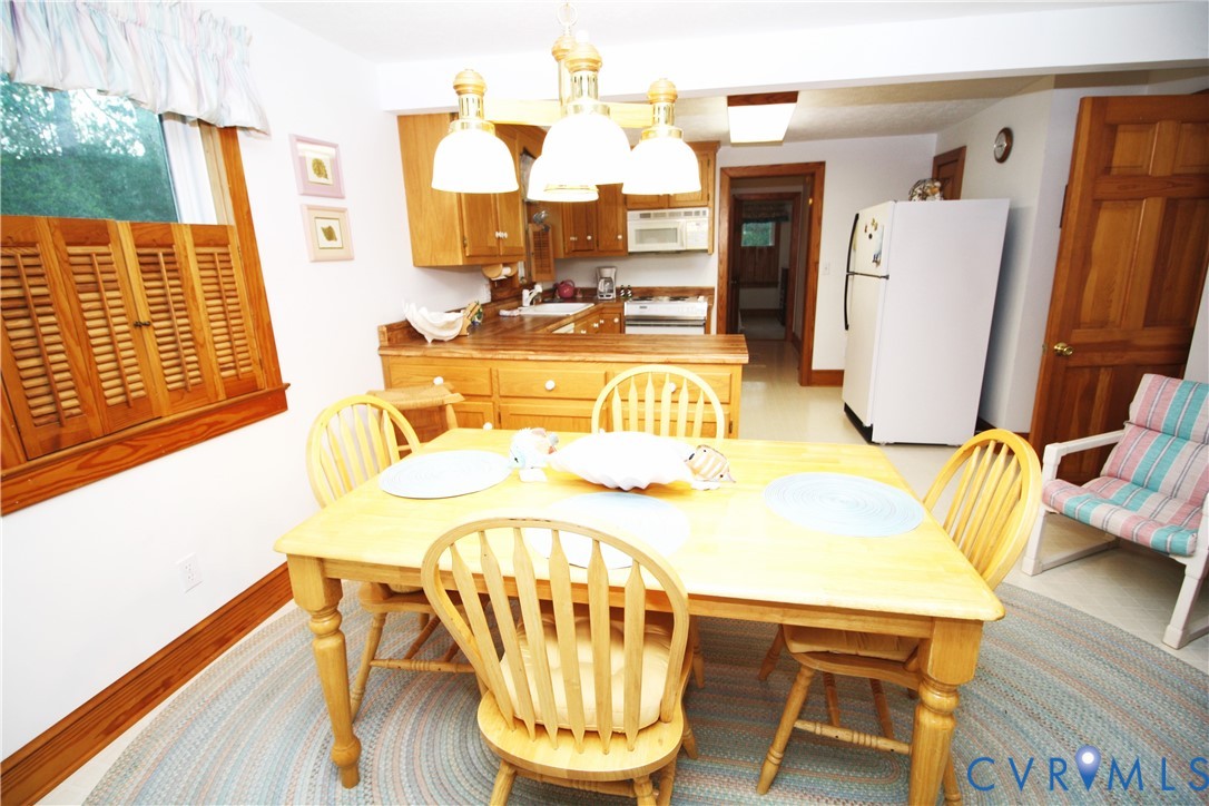 68 Springtide Lane Port Haywood, VA 23138 - Photo 11 of 33 a view of a kitchen with furniture and wooden floor