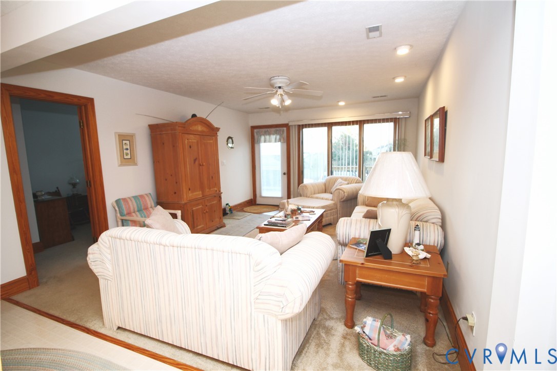 68 Springtide Lane Port Haywood, VA 23138 - Photo 10 of 33 a bedroom with furniture and a large window