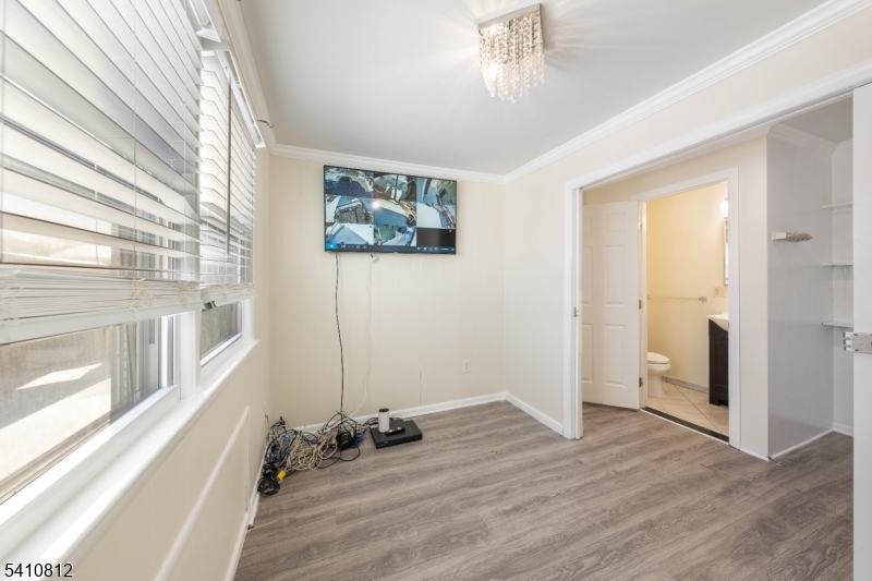 985 Arnet Avenue Union, NJ 07083 - Photo 11 of 26 a view of a big room with wooden floor and windows