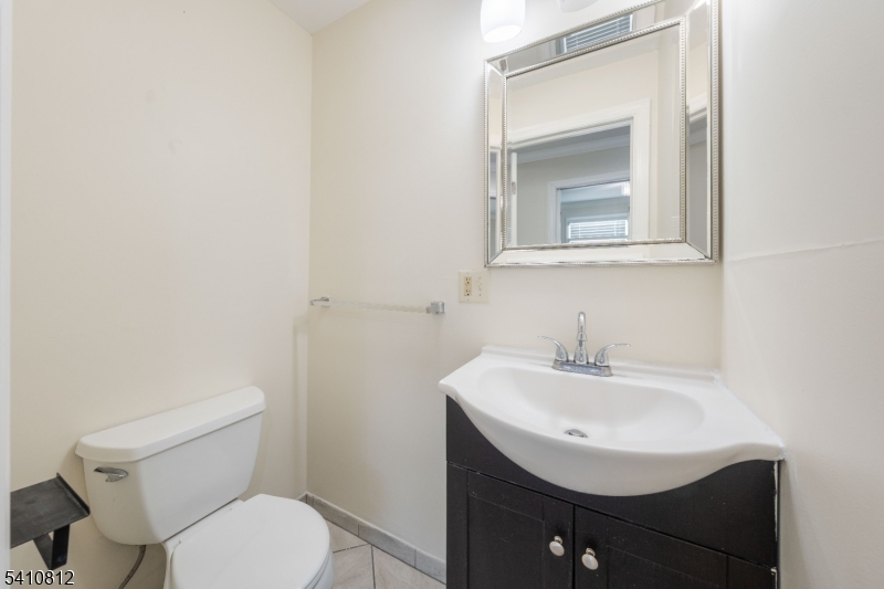 985 Arnet Avenue Union, NJ 07083 - Photo 12 of 26 a bathroom with a sink toilet and mirror