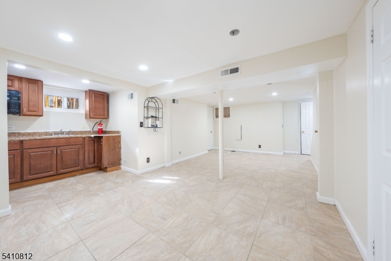 985 Arnet Avenue Union, NJ 07083 - Photo 15 of 26 a view of a kitchen with a sink and cabinets