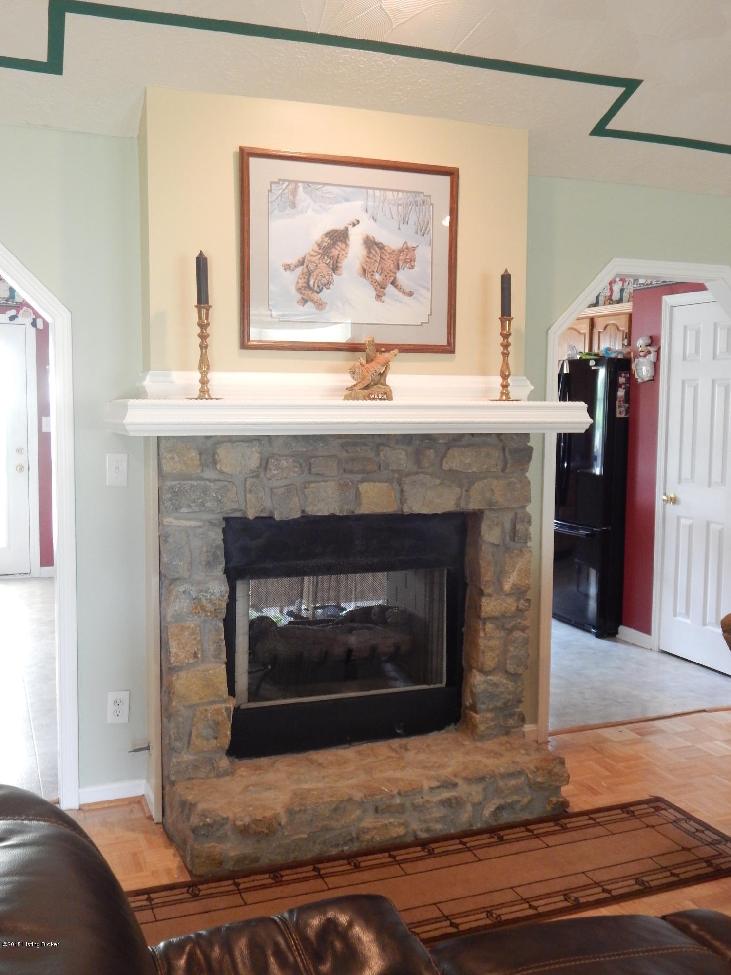 Stone fireplace goes thru to kitchen!