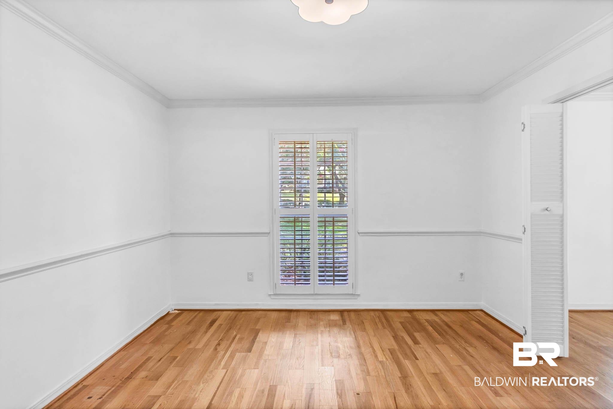 309 West Brandy Run Road Mobile, AL 36608 - Photo 32 of 100 Empty room with wood finished floors and ornamental molding