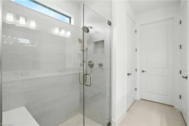 a bathroom with a glass shower door