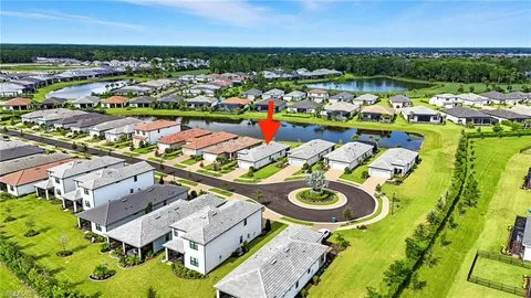 an aerial view of a house with a ocean view