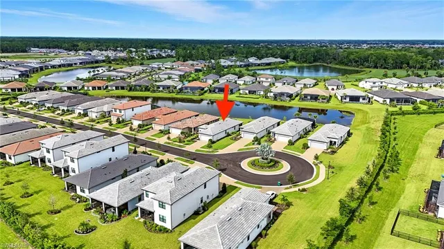 an aerial view of a house with a ocean view