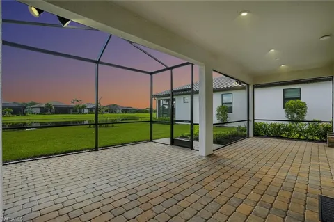 a view of a park with wooden fence