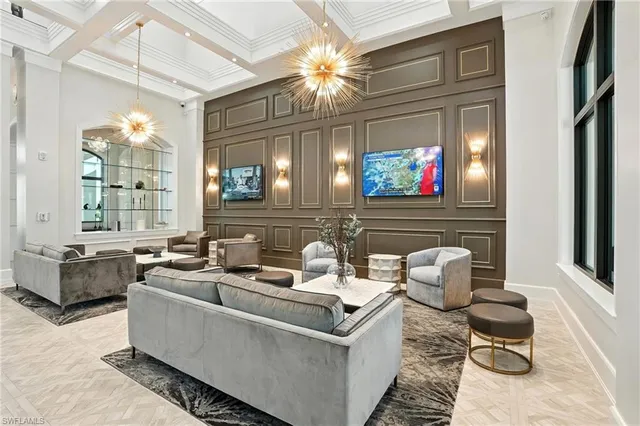 a lobby with furniture and floor to ceiling window