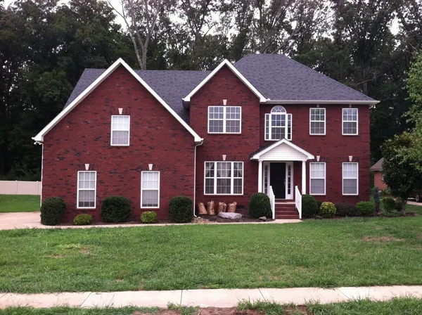 a front view of a house with a yard