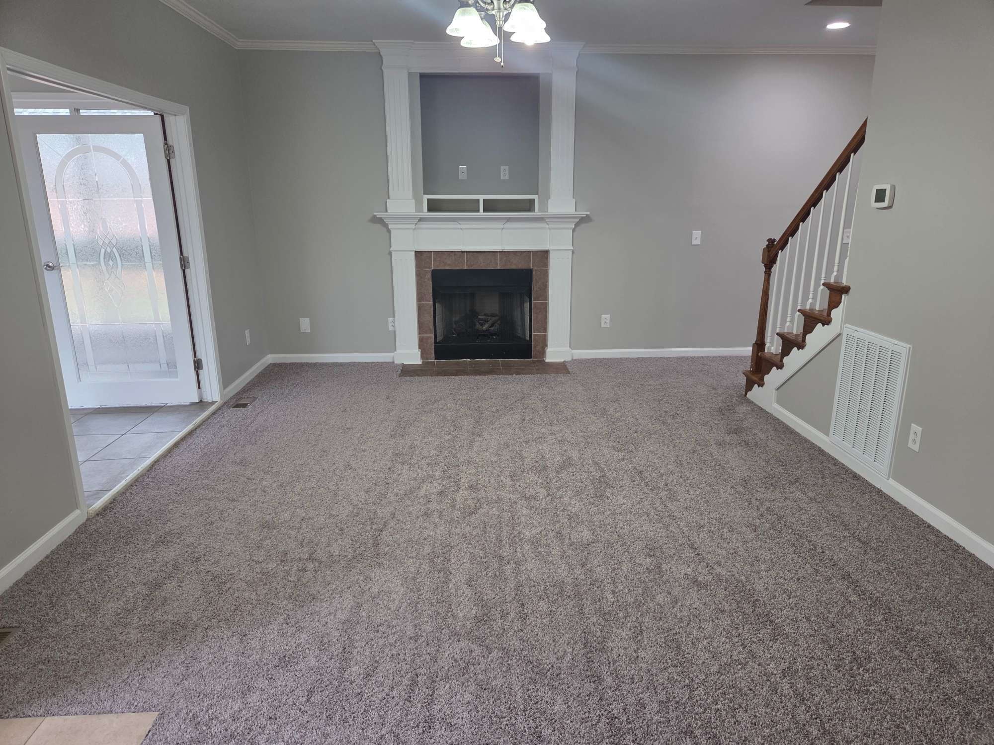 617 Rambush Drive Murfreesboro, TN 37128 - Photo 6 of 32 a view of a livingroom with an empty space and a fireplace