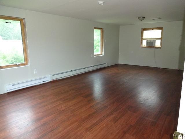 552 Interchange Road Kunkletown, PA 18058 - Photo 18 of 20 an empty room with wooden floor and windows