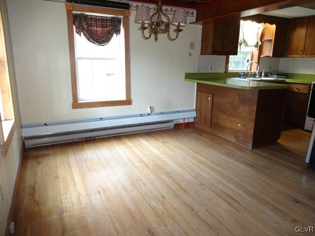 552 Interchange Road Kunkletown, PA 18058 - Photo 10 of 20 a kitchen with a wooden floor and a window