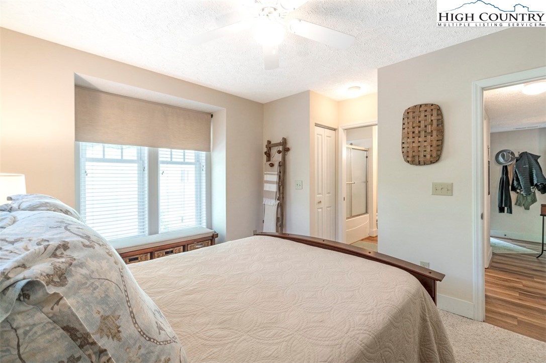 166 Still Lake Drive, Unit 222 Boone, NC 28607 - Photo 26 of 37 a bedroom with a bed and a window