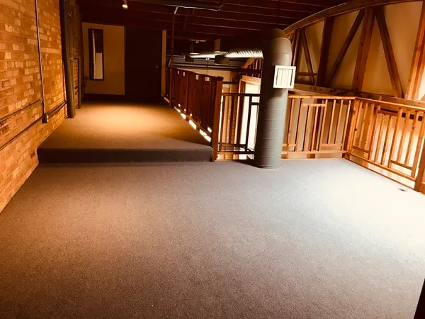 a view of an empty room with stairs