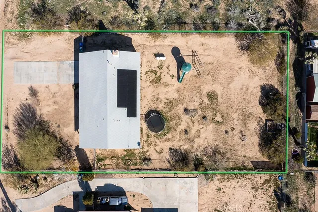 an aerial view of residential building and parking space