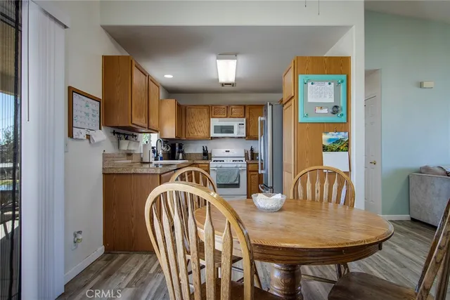 a kitchen with a sink stove and refrigerator