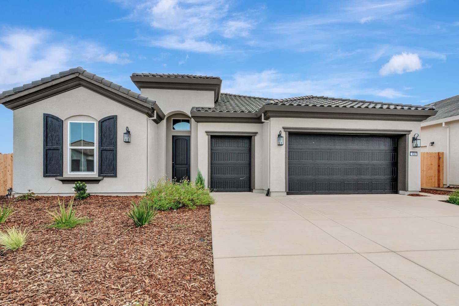 a front view of a house with garage