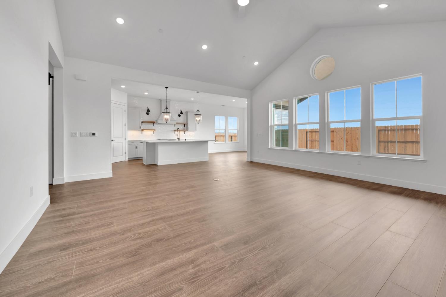 4327 Hooded Crow Way Rancho Cordova, CA 95742 - Photo 19 of 58 a view of an empty room with window and wooden floor