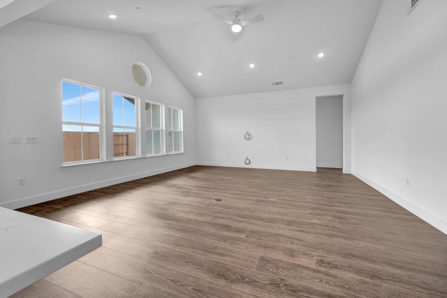 4327 Hooded Crow Way Rancho Cordova, CA 95742 - Photo 20 of 58 an empty room with wooden floor and windows