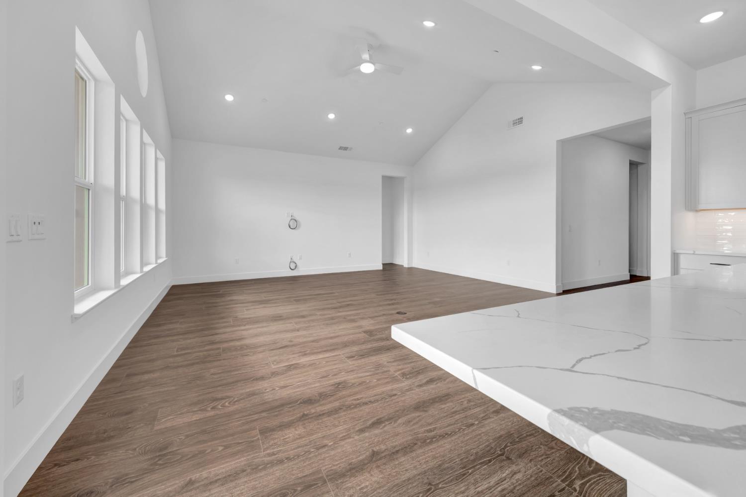 4327 Hooded Crow Way Rancho Cordova, CA 95742 - Photo 21 of 58 an empty room with wooden floor and windows