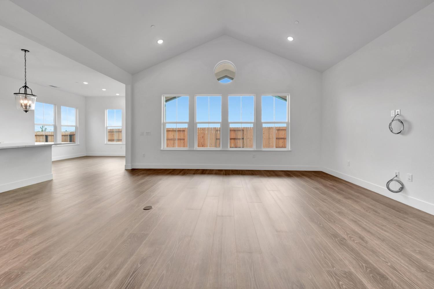 4327 Hooded Crow Way Rancho Cordova, CA 95742 - Photo 23 of 58 an empty room with wooden floor and windows