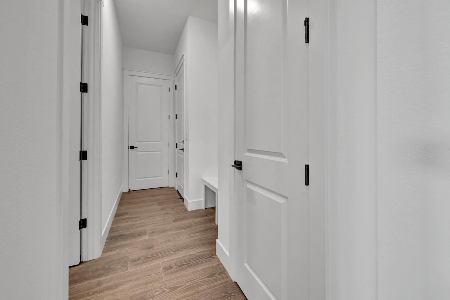 4327 Hooded Crow Way Rancho Cordova, CA 95742 - Photo 26 of 58 a view of a hallway with wooden floor and closet area