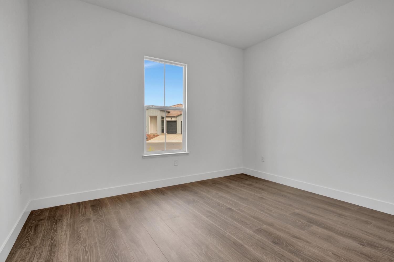 4327 Hooded Crow Way Rancho Cordova, CA 95742 - Photo 35 of 58 a view of a small space with wooden floor and a window