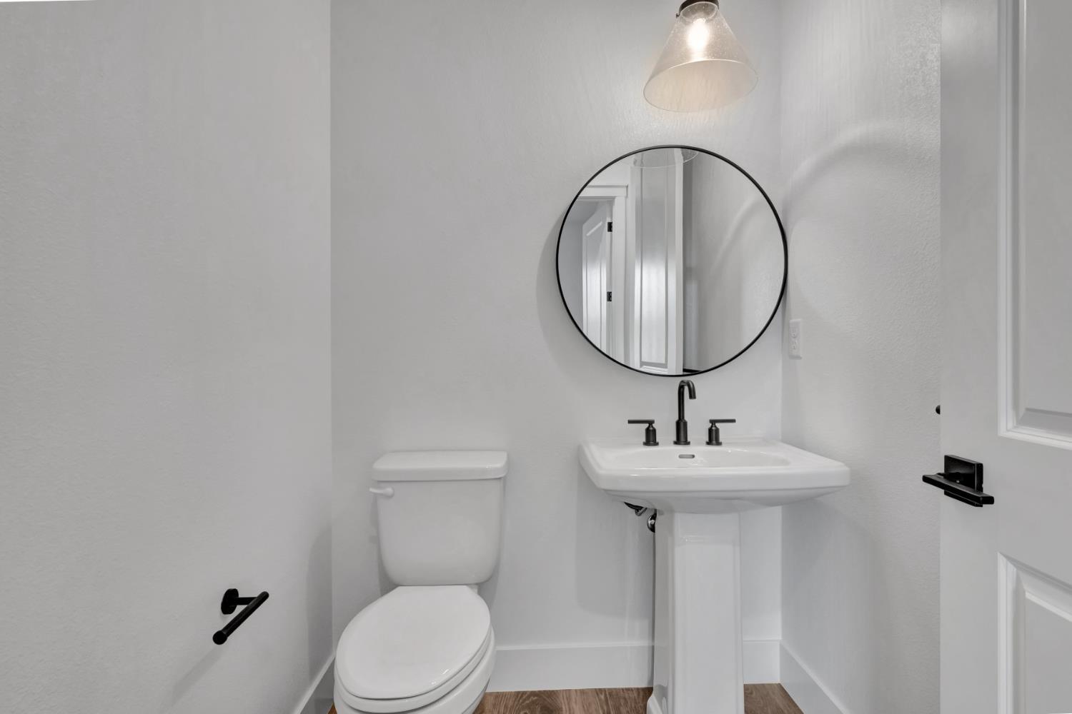 4327 Hooded Crow Way Rancho Cordova, CA 95742 - Photo 36 of 58 a bathroom with a sink a toilet and mirror